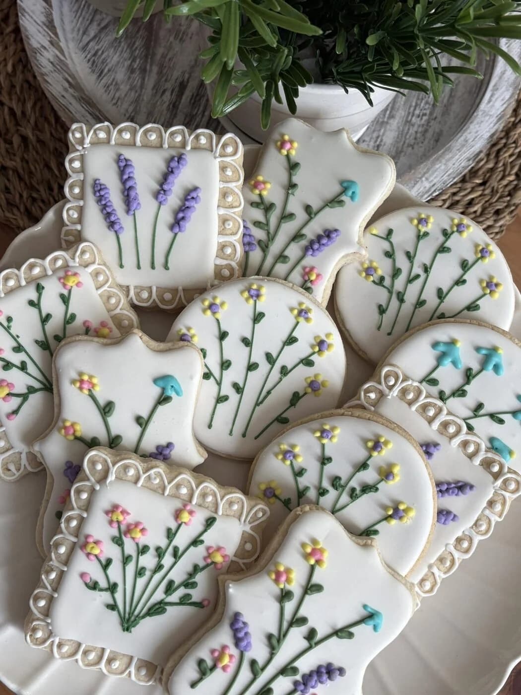 Hand-piped floral sugar cookies with lavender and pastel accents